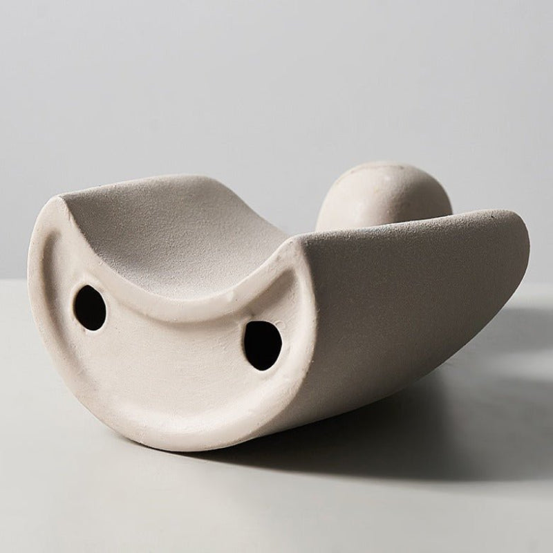 Modern sculpture symbolizing connection and tenderness