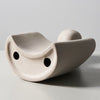 Modern sculpture symbolizing connection and tenderness