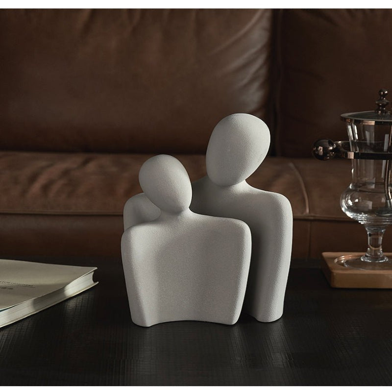 Modern sculpture symbolizing connection and tenderness
