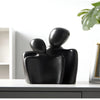 Modern sculpture symbolizing connection and tenderness